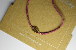 Gold amaranth cowrie shell bracelet
